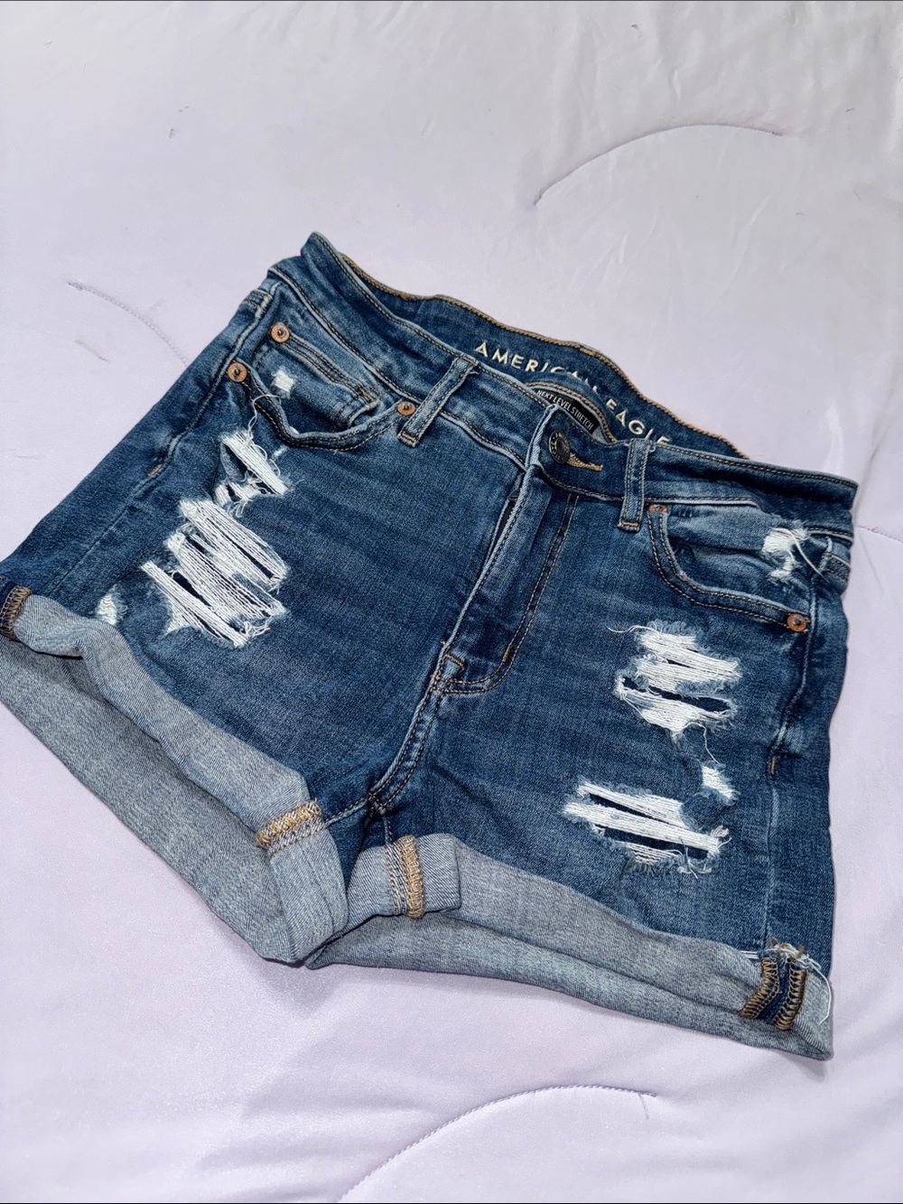 American Eagle Outfitters High-Waisted Distressed Rolled Hem Denim Shorts - Blue